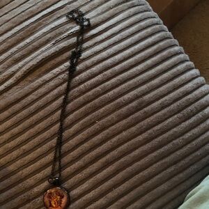 Black Pendant Necklace with Red and Gold Design